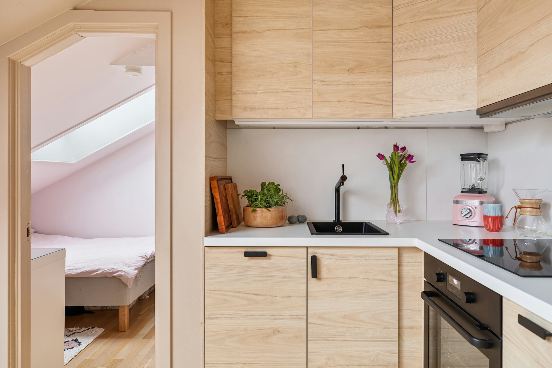 A kitchen with a sink and a stove top oven